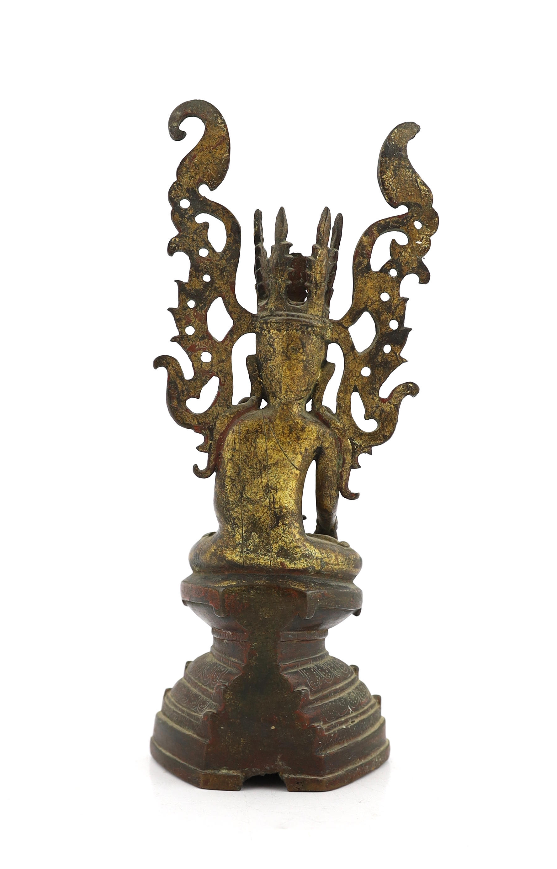 A Burmese gilt bronze seated figure of Jambupati Buddha on a throne, Shan, 17th-18th century, losses to headdress